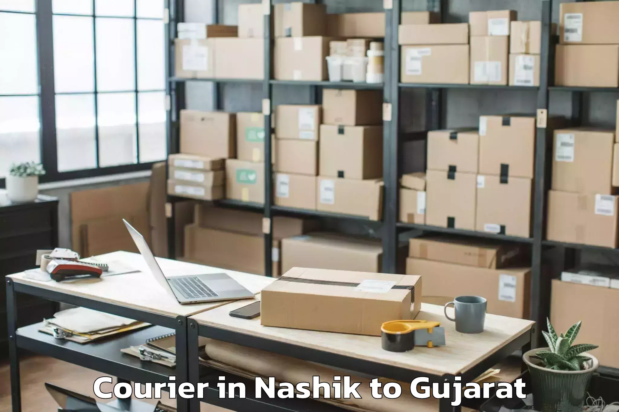 Reliable Nashik to Balasinor Courier